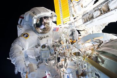 Astronaut working outside the space station